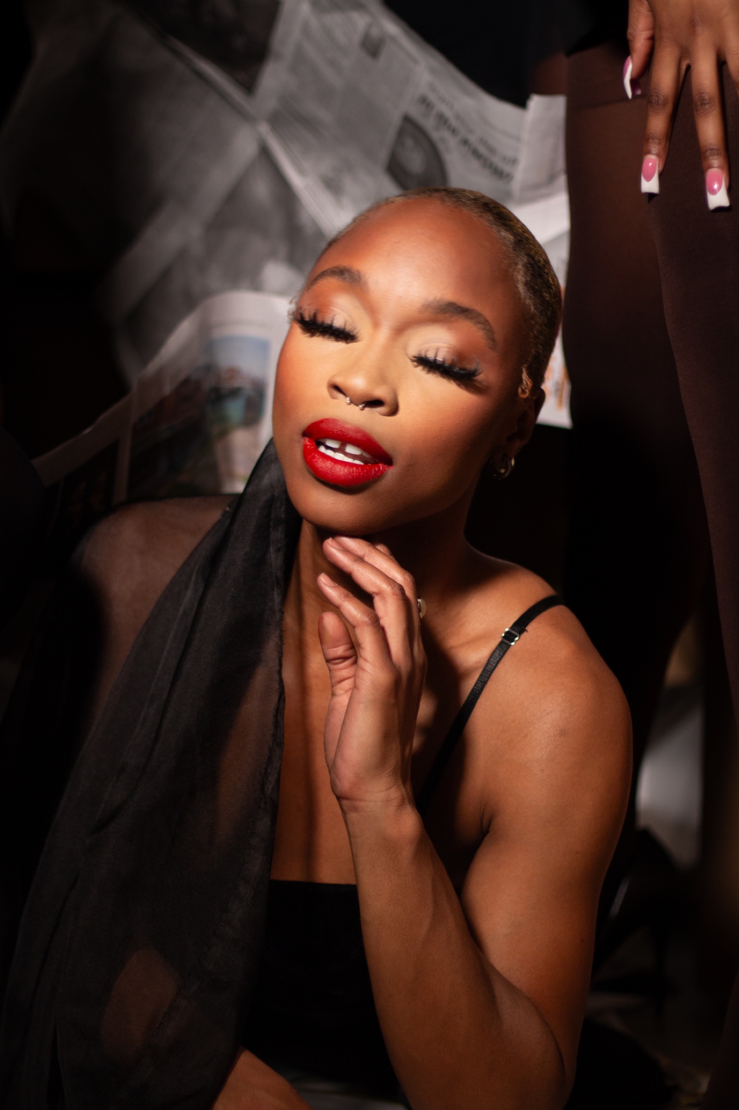 Close-up editorial beauty portrait with dramatic light