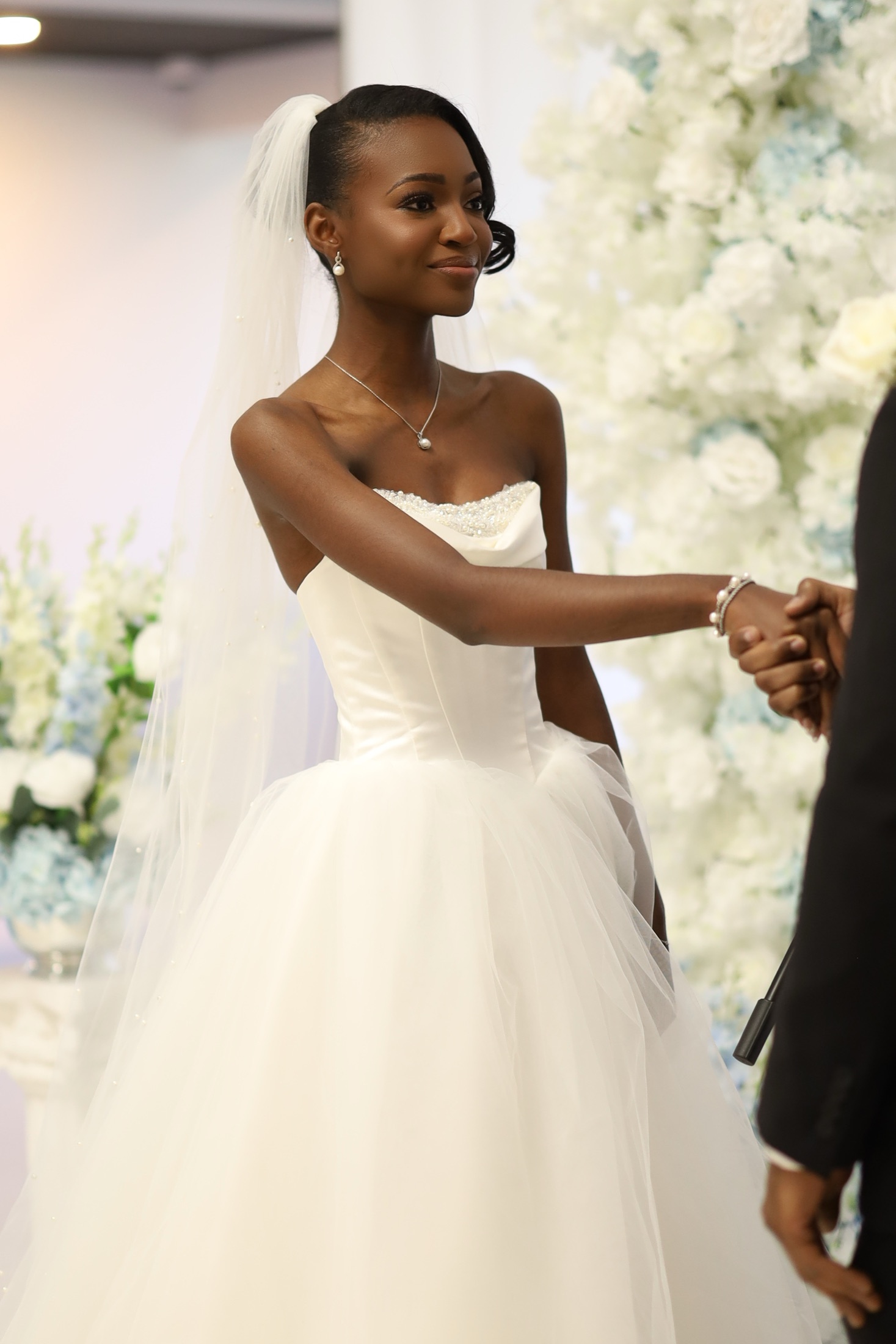 Bride in a strapless gown during a ceremony